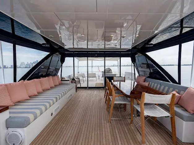 Slide: The Image of Luxurious interior of 2015 Hatteras 100 Raised Pilothouse yacht with seating and dining area. - 36