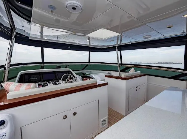 Slide: The Image of Interior of 2015 Hatteras 100 Raised Pilothouse yacht with modern helm station. - 40