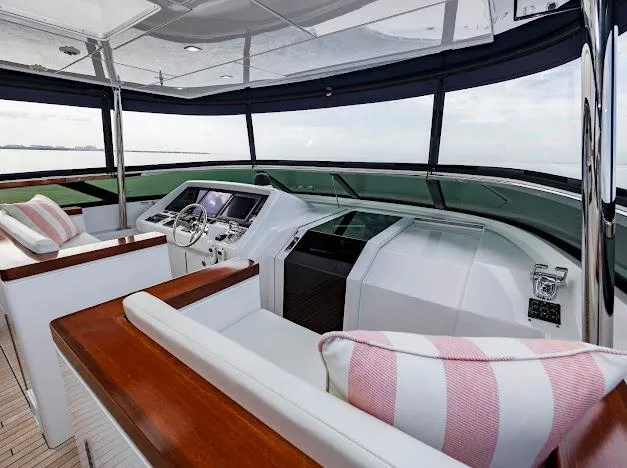 Slide: The Image of Luxurious 2015 Hatteras 100 Raised Pilothouse yacht interior with modern helm and plush seating. - 42