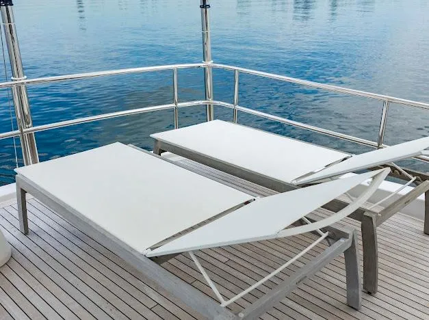 Slide: The Image of Sun loungers on the deck of a 2015 Hatteras 100 Raised Pilothouse yacht. - 49