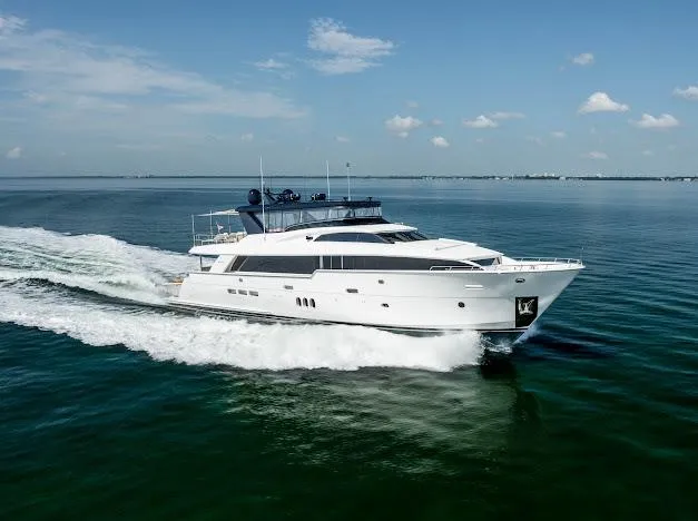 Slide: The Image of 2015 Hatteras 100 Raised Pilothouse yacht cruising on open water. - 9