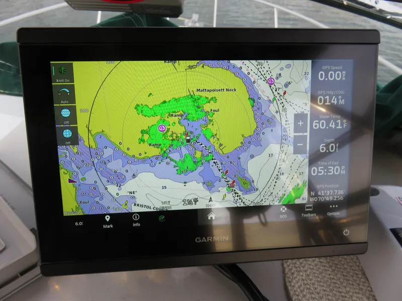 Slide: The Image of Garmin navigation display on 1999 Stamas 250 Express boat, showing nautical chart and route details. - 2