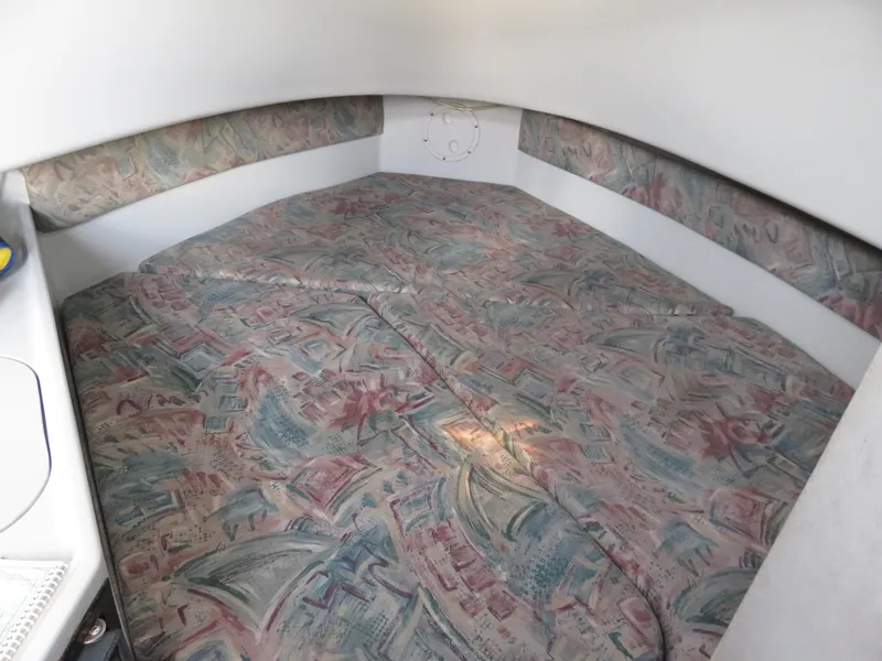 Slide: The Image of 1999 Stamas 250 Express cabin interior with patterned bedding and white walls. - 24