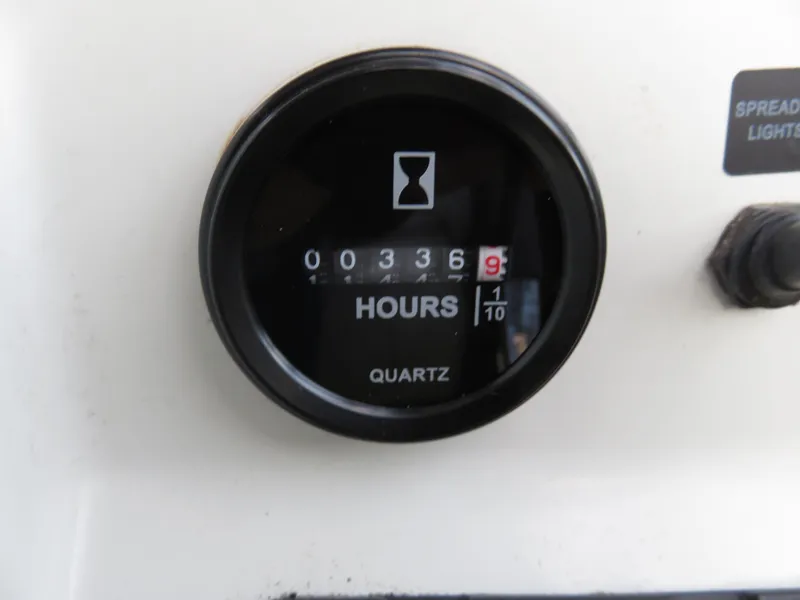 Slide: The Image of Hour meter on 1999 Stamas 250 Express boat, displaying 336.9 hours. - 3