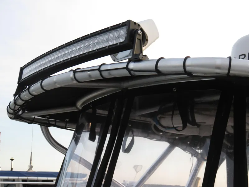 Slide: The Image of 1999 Stamas 250 Express boat with mounted LED light bar on the roof. - 6