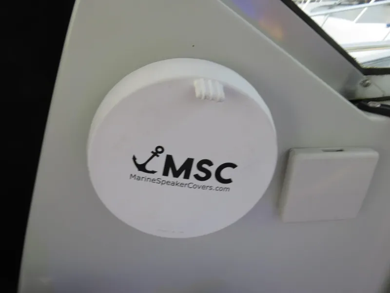 Slide: The Image of Marine speaker cover on 1999 Stamas 250 Express boat, featuring MSC logo. - 9