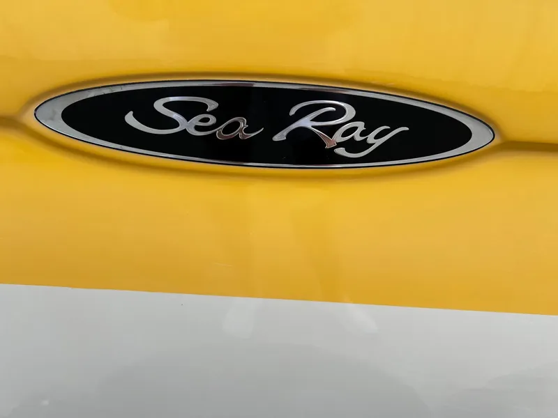 Slide: The Image of Sea Ray 200 Sport 2005 logo on yellow and white boat. - 19
