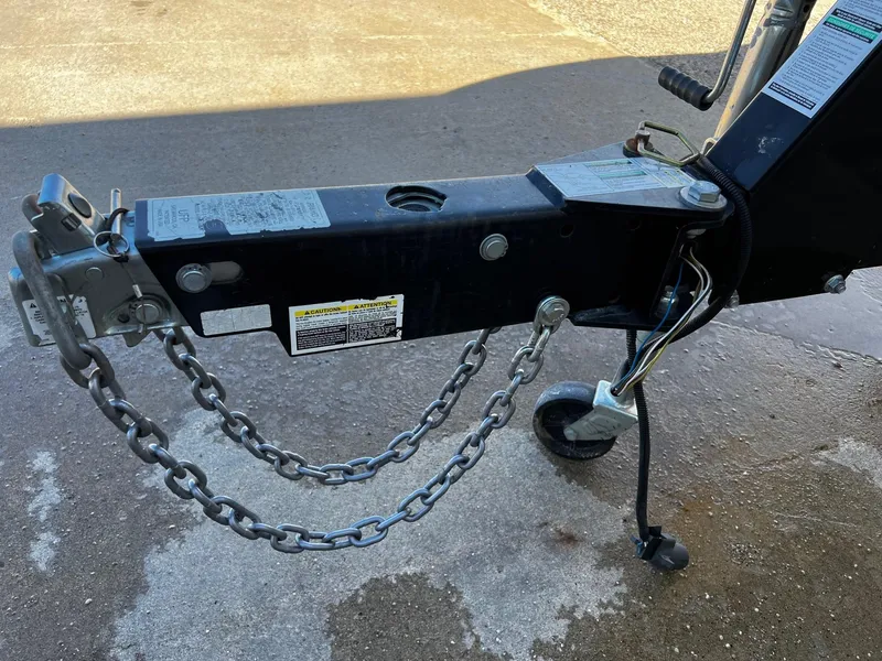 Slide: The Image of Close-up of a 2005 Sea Ray 200 Sport boat trailer hitch with safety chains. - 22