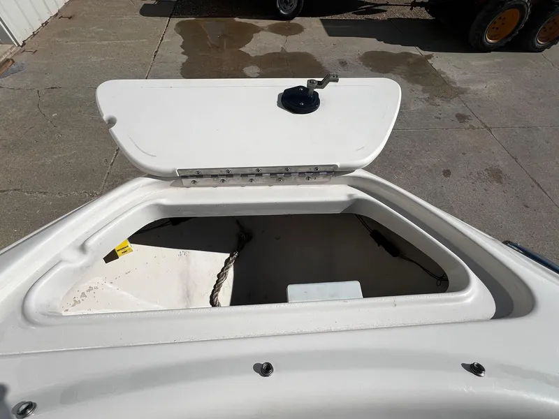 Slide: The Image of Open storage compartment on a 2005 Sea Ray 200 Sport boat. - 7