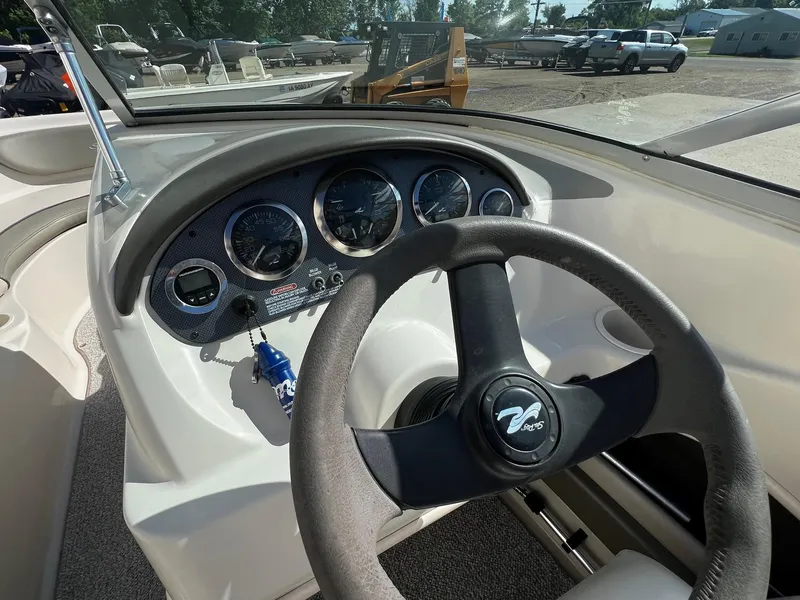 Slide: The Image of 2005 Sea Ray 200 Sport boat dashboard and steering wheel. - 8