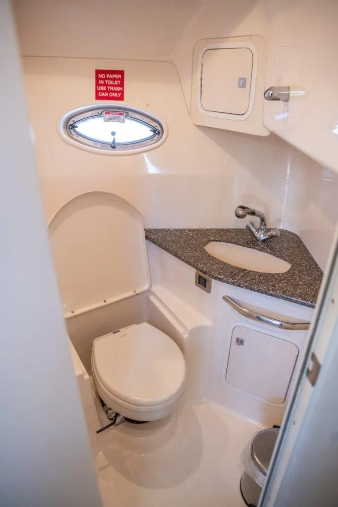 Slide: The Image of 2008 Sea Ray 44 Sundancer bathroom with modern fixtures and compact design. - 10