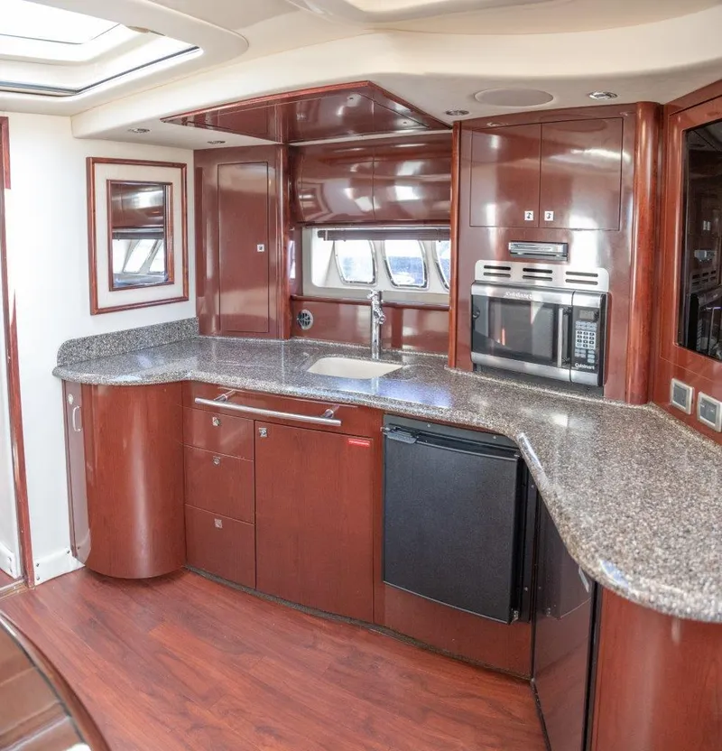 Slide: The Image of Luxurious kitchen interior of 2008 Sea Ray 44 Sundancer yacht with modern appliances. - 12