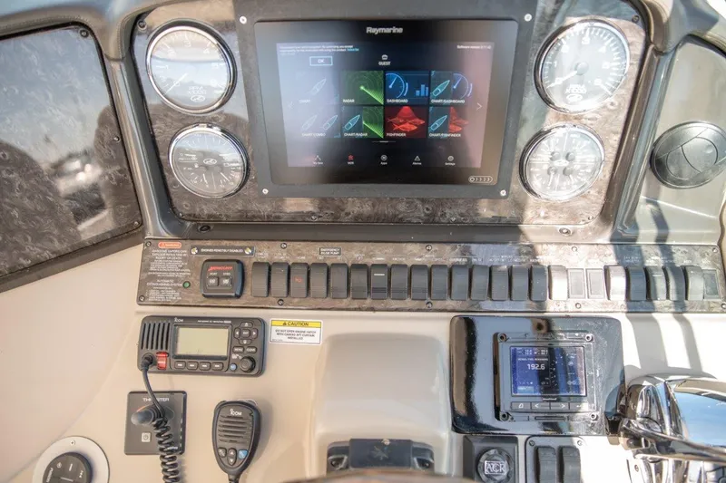 Slide: The Image of Control panel of 2008 Sea Ray 44 Sundancer with navigation and communication equipment. - 6