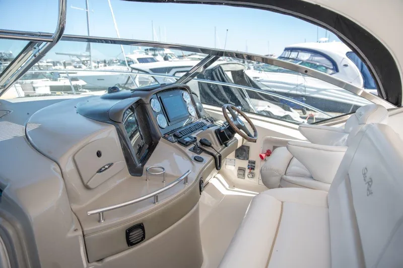 Slide: The Image of Interior view of 2008 Sea Ray 44 Sundancer yacht cockpit with modern controls. - 7