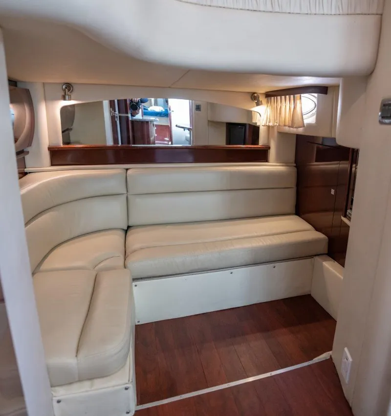 Slide: The Image of Interior of 2008 Sea Ray 44 Sundancer with cream leather seating and wood flooring. - 9