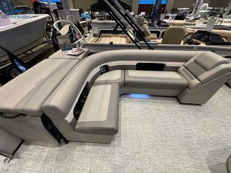 Slide: The Image of 2024 Premier Sunsation 230 RE pontoon boat interior with luxurious seating. - 10