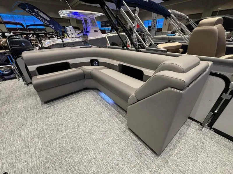 Slide: The Image of 2024 Premier Sunsation 230 RE pontoon boat interior with gray seating. - 11