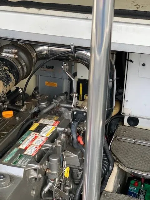 Slide: The Image of Engine compartment of a 2005 Formula 40 PC boat showing various mechanical components. - 12