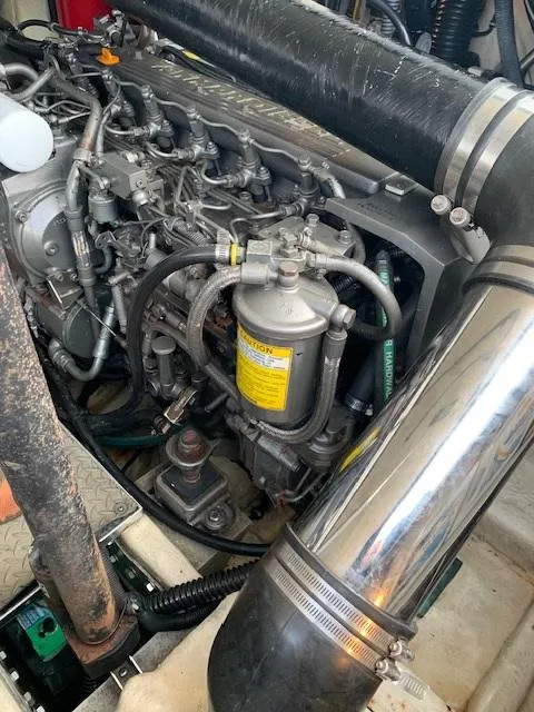 Slide: The Image of Engine compartment of a 2005 Formula 40 PC boat showing detailed mechanical components. - 13