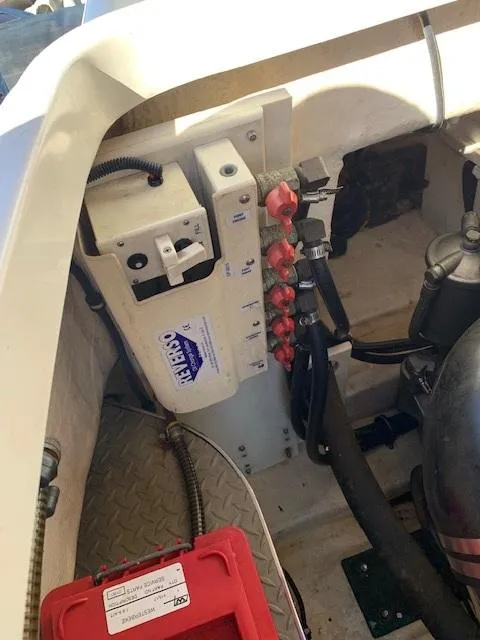 Slide: The Image of Engine compartment of a 2005 Formula 40 PC boat with electrical components. - 14