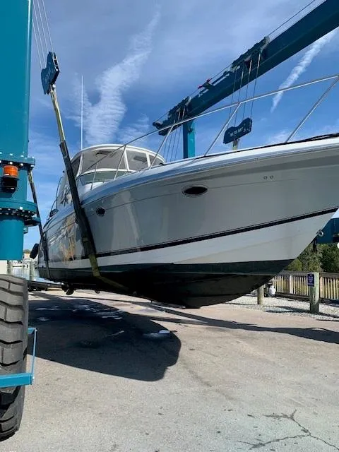 Slide: The Image of 2005 Formula 40 PC yacht being lifted by a boat hoist. - 17