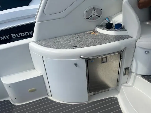 Slide: The Image of 2005 Formula 40 PC boat interior with mini fridge and storage compartments. - 4