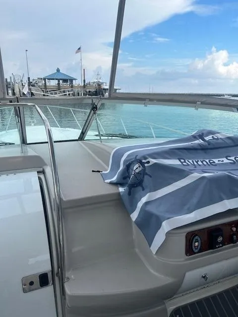 Slide: The Image of 2005 Formula 40 PC yacht docked at marina with blue towel on deck. - 6