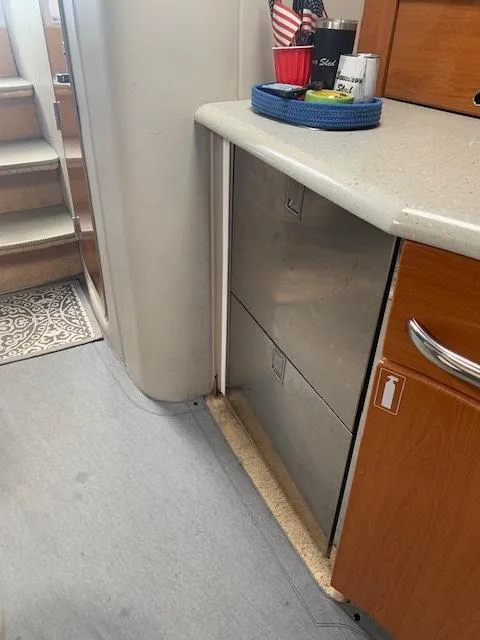 Slide: The Image of 2005 Formula 40 PC yacht interior with stairs and kitchen counter. - 8