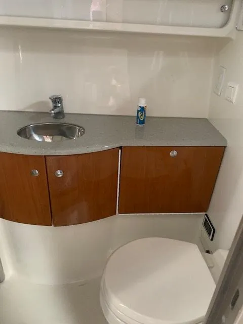 Slide: The Image of 2005 Formula 40 PC boat bathroom with sink, cabinets, and toilet. - 9