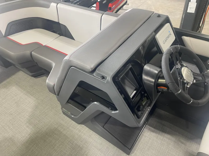 Slide: The Image of 2024 Manitou Cruise boat interior with modern dashboard and seating. - 8