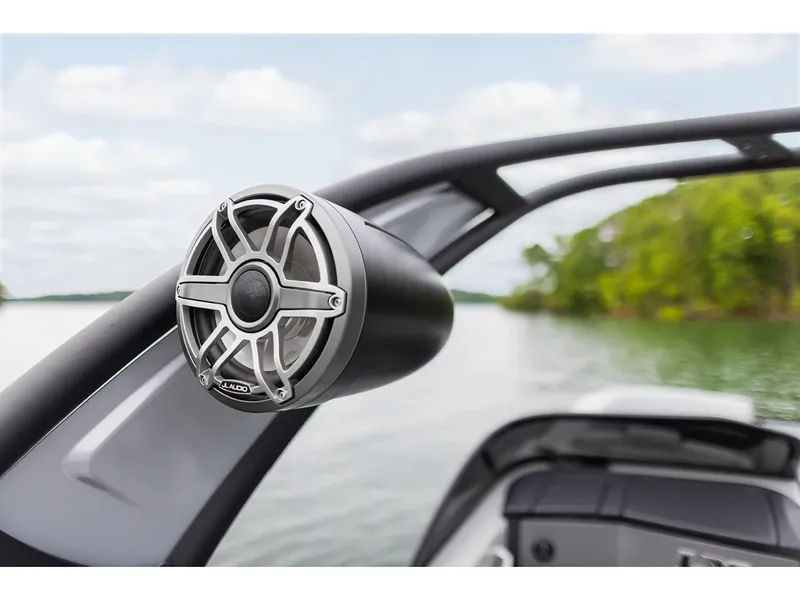 Slide: The Image of Close-up of 2024 Manitou 25 LX RF boat speaker on a lake. - 20