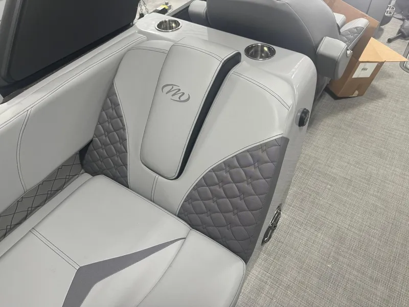 Slide: The Image of Luxurious seating in 2024 Manitou 25 LX RF boat with quilted design and cup holders. - 7