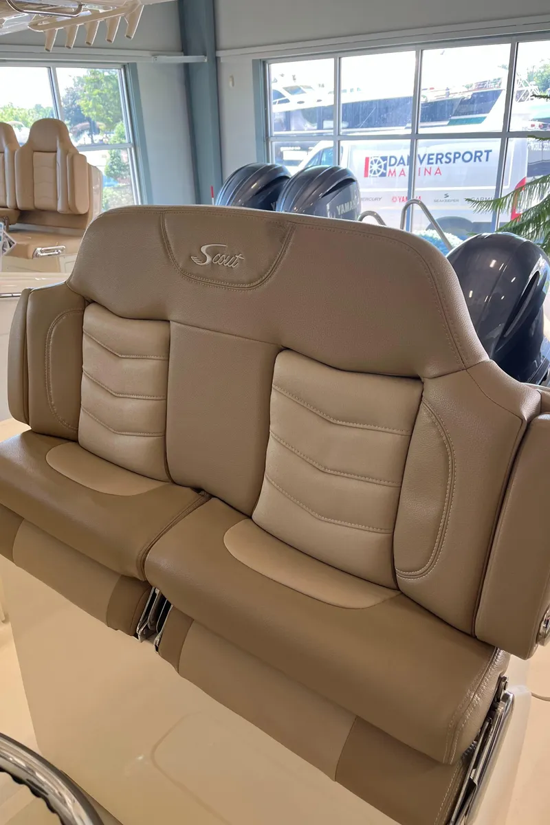 Slide: The Image of 2020 Scout 255 LXF boat interior seating with beige leather upholstery. - 10