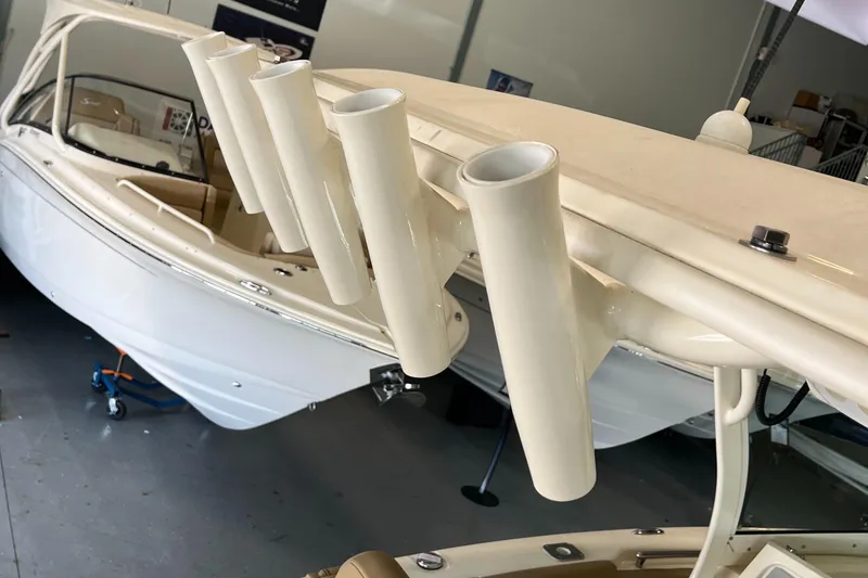 Slide: The Image of 2020 Scout 255 LXF boat with rod holders in showroom. - 16