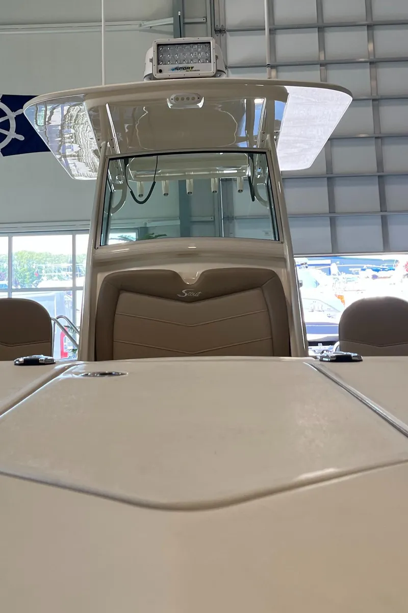 Slide: The Image of 2020 Scout 255 LXF boat in a showroom, front view. - 17