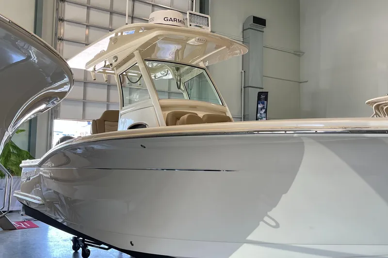 Slide: The Image of 2020 Scout 255 LXF boat in showroom. - 3
