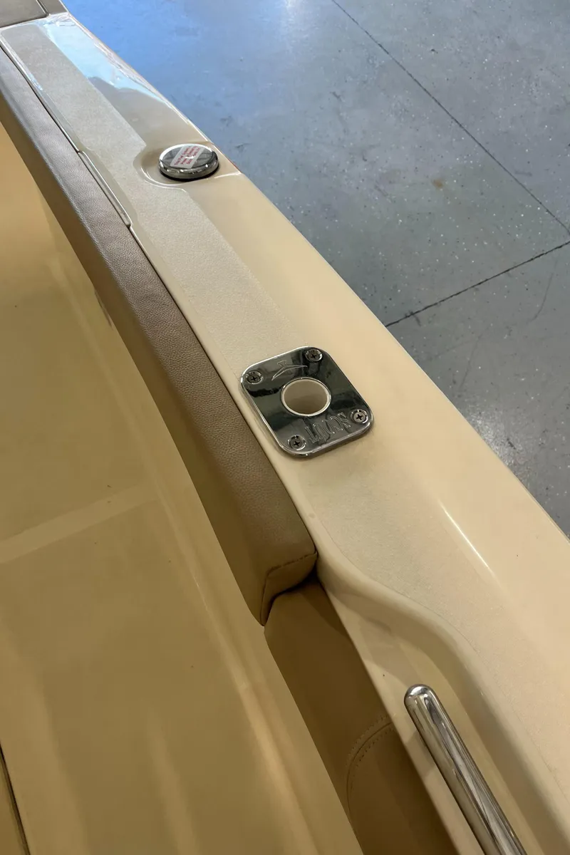 Slide: The Image of 2020 Scout 255 LXF boat interior detail showing rod holder and seating. - 8