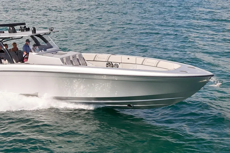 Slide: The Image of 2018 Midnight Express 43 Open boat cruising on clear blue water. - 10