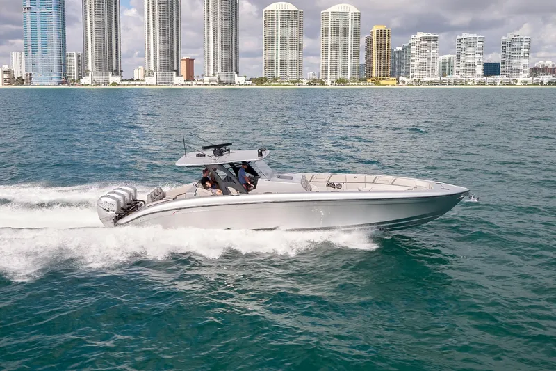 Slide: The Image of 2018 Midnight Express 43 Open boat cruising near city skyline. - 11