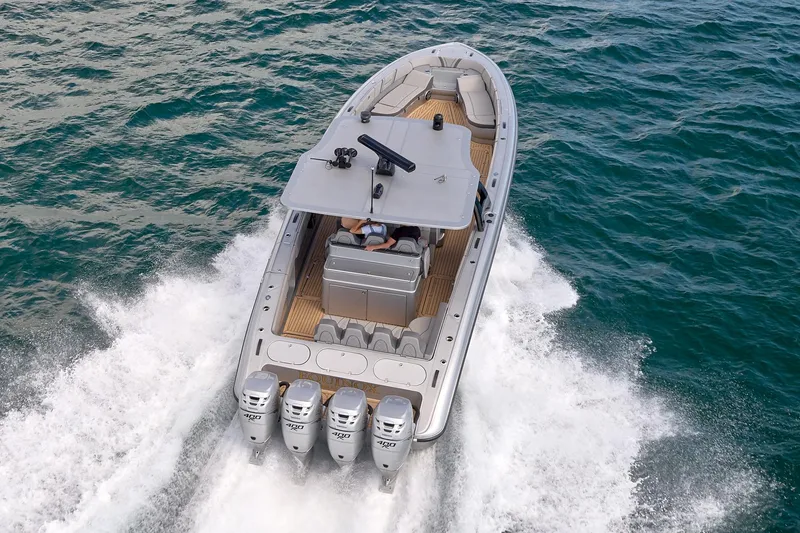 Slide: The Image of 2018 Midnight Express 43 Open boat cruising on ocean with four powerful engines. - 15