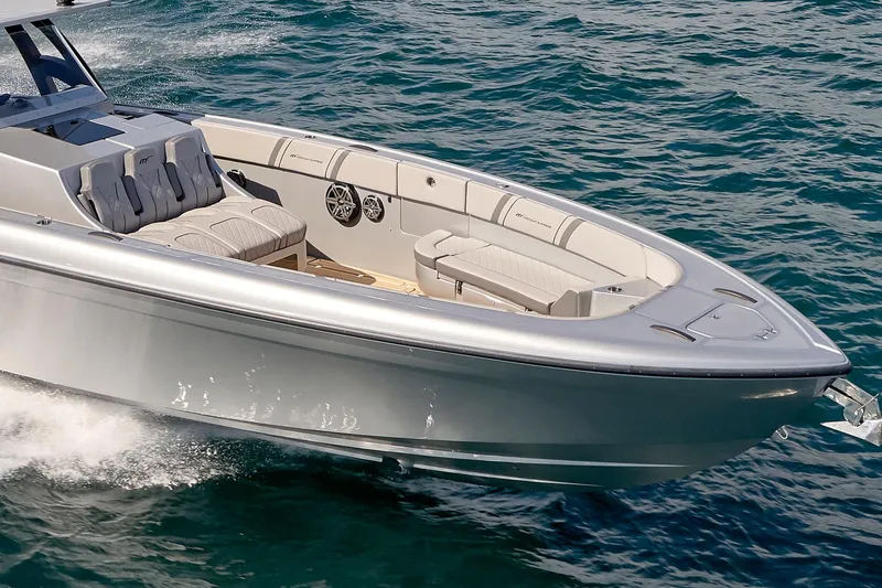 Slide: The Image of 2018 Midnight Express 43 Open boat cruising on clear blue water. - 21