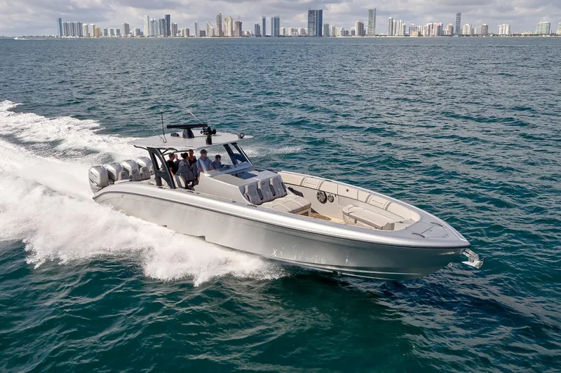 Slide: The Image of 2018 Midnight Express 43 Open boat cruising on ocean with city skyline in background. - 22