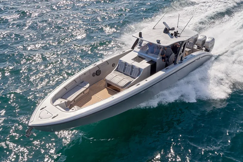 Slide: The Image of 2018 Midnight Express 43 Open boat cruising on ocean waters. - 24