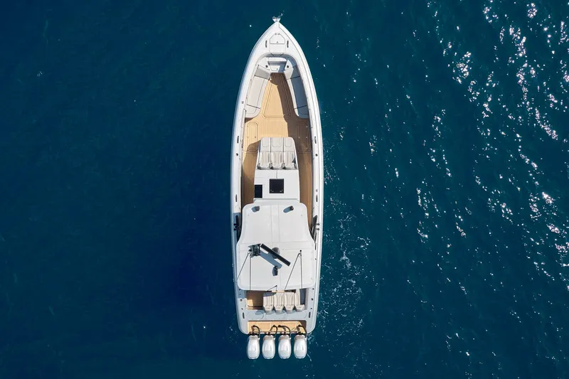 Slide: The Image of Aerial view of 2018 Midnight Express 43 Open boat on blue water. - 26