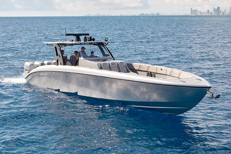 Slide: The Image of 2018 Midnight Express 43 Open boat cruising on blue ocean waters. - 27