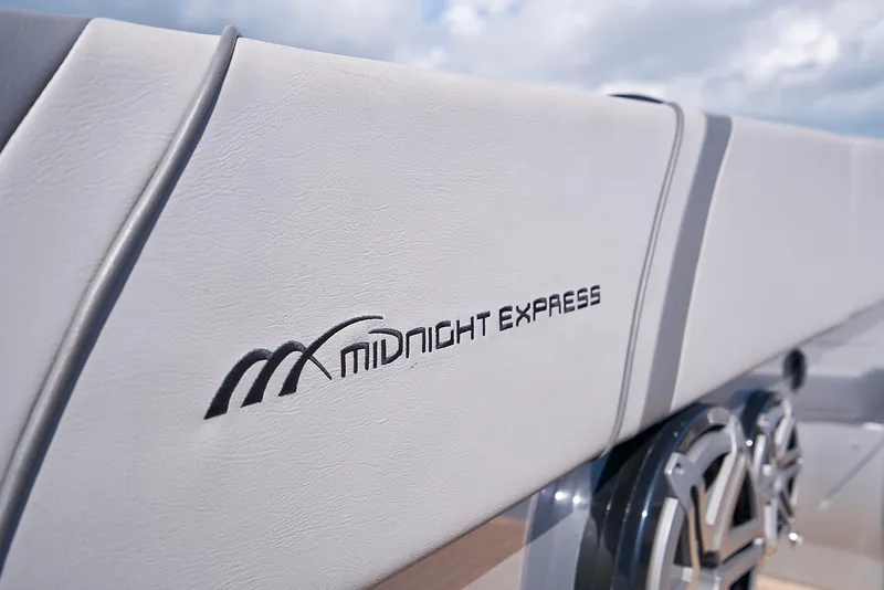 Slide: The Image of 2018 Midnight Express 43 Open boat interior with logo detail. - 32