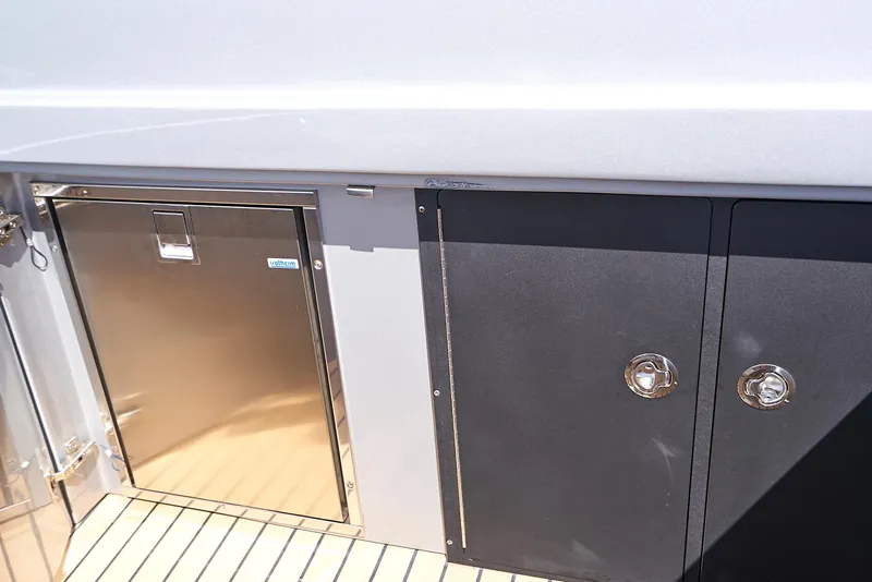 Slide: The Image of 2018 Midnight Express 43 Open yacht storage compartments and stainless steel door. - 38