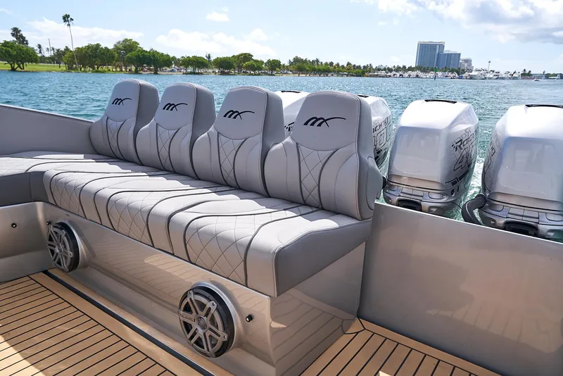 Slide: The Image of Luxury seating on a 2018 Midnight Express 43 Open boat with powerful outboard engines. - 40