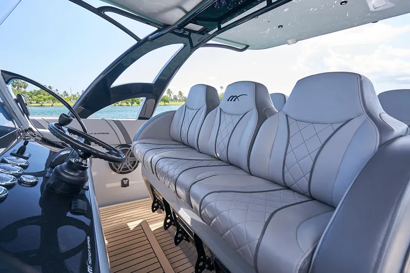 Slide: The Image of 2018 Midnight Express 43 Open boat interior with luxurious seating and modern dashboard. - 41