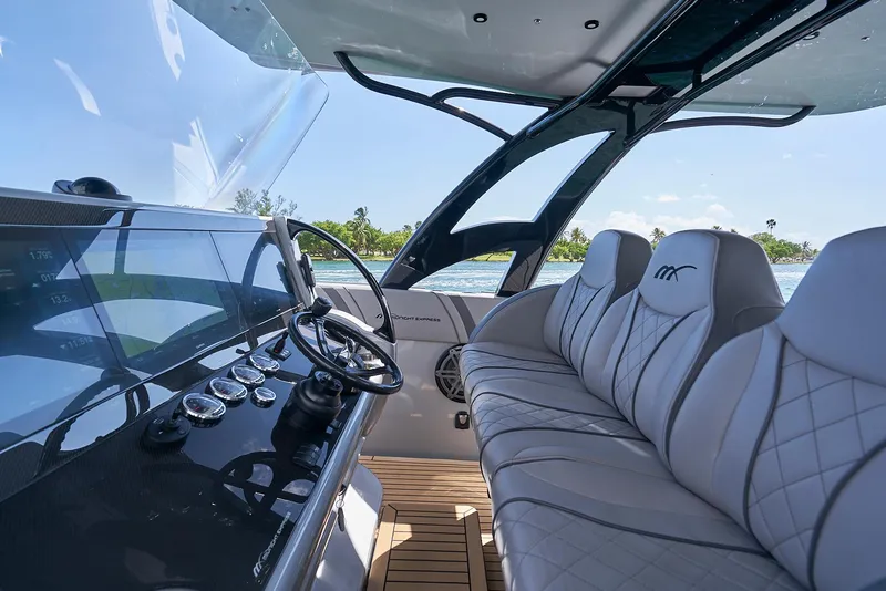 Slide: The Image of Luxurious 2018 Midnight Express 43 Open yacht interior with sleek dashboard and plush seating. - 44